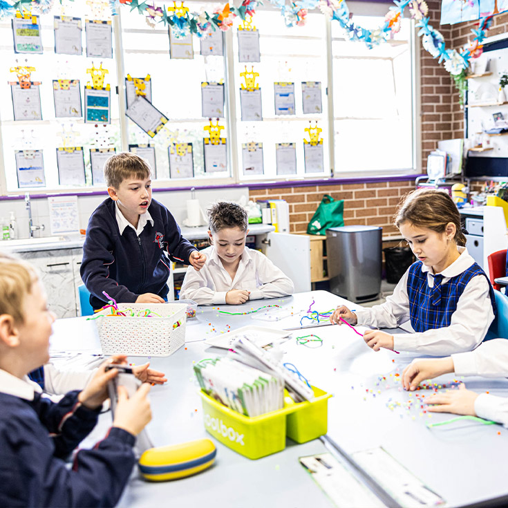 Students sitting at their desks in Bethany Catholic Primary School Glenmore Park classroom