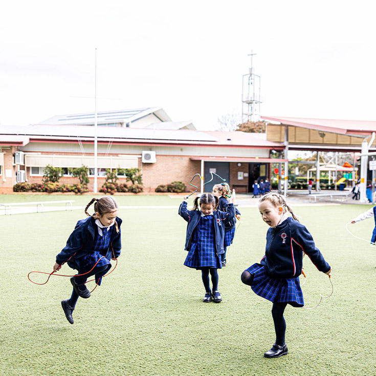 Students skipping in the playground at Bethany Catholic Primary School Glenmore Park