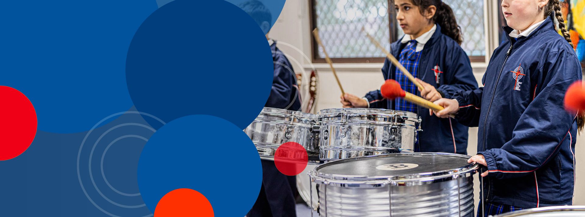 Students playing the drums in music class at Bethany Catholic Primary School Glenmore Park
