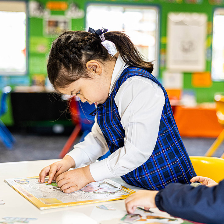 Student doing a puzzle at Bethany Catholic Primary School Glenmore Park