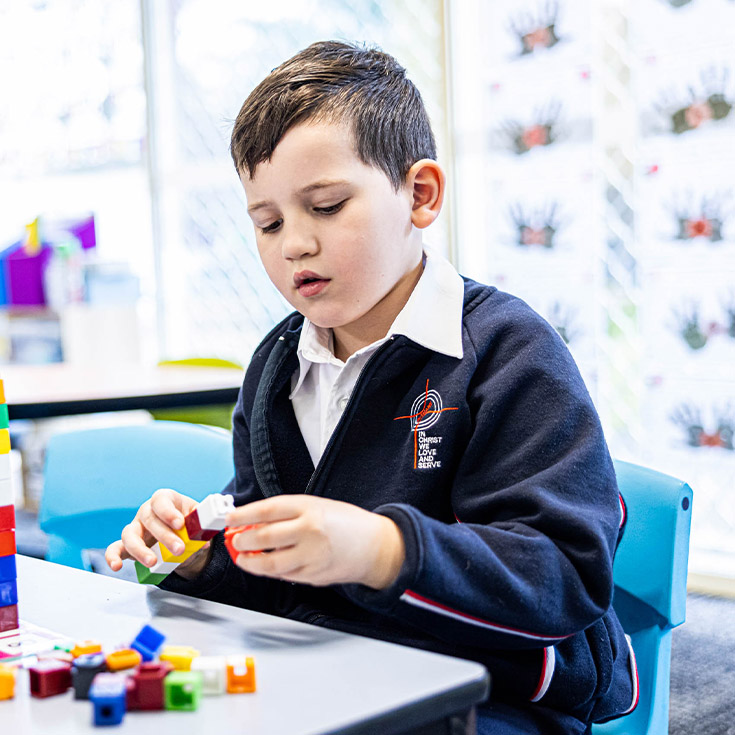 Student using counting blocks at Bethany Catholic Primary School Glenmore Park