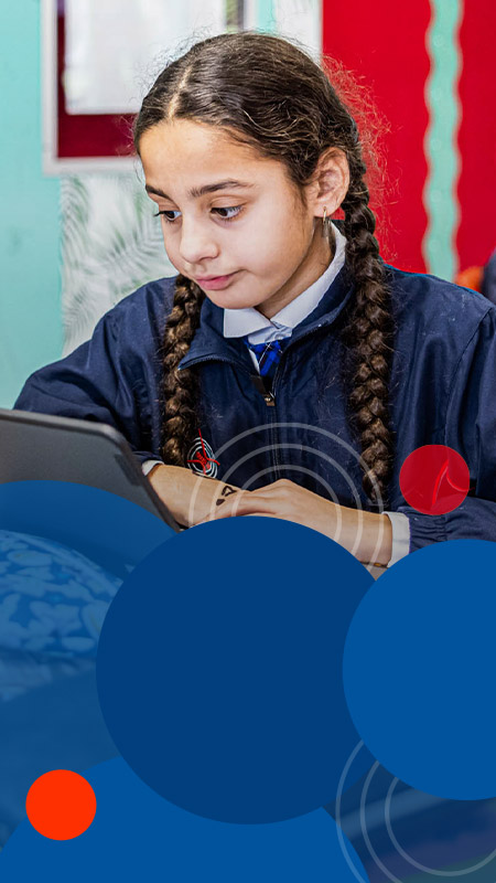 Student using laptop in the classroom at Bethany Catholic Primary School Glenmore Park