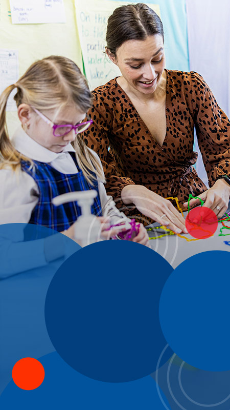 Teacher supporting student at Bethany Catholic Primary School Glenmore Park