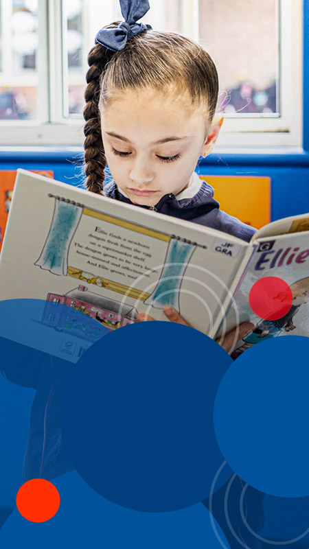 Student reading in the library at Bethany Catholic Primary School Glenmore Park