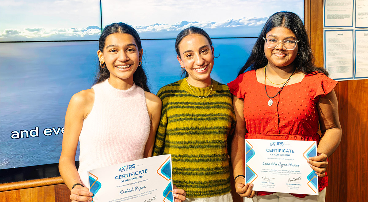 Photo: JRSโs Kristen Lazarus (centre) with award recipients Kashish (L) and Evanshka (R)